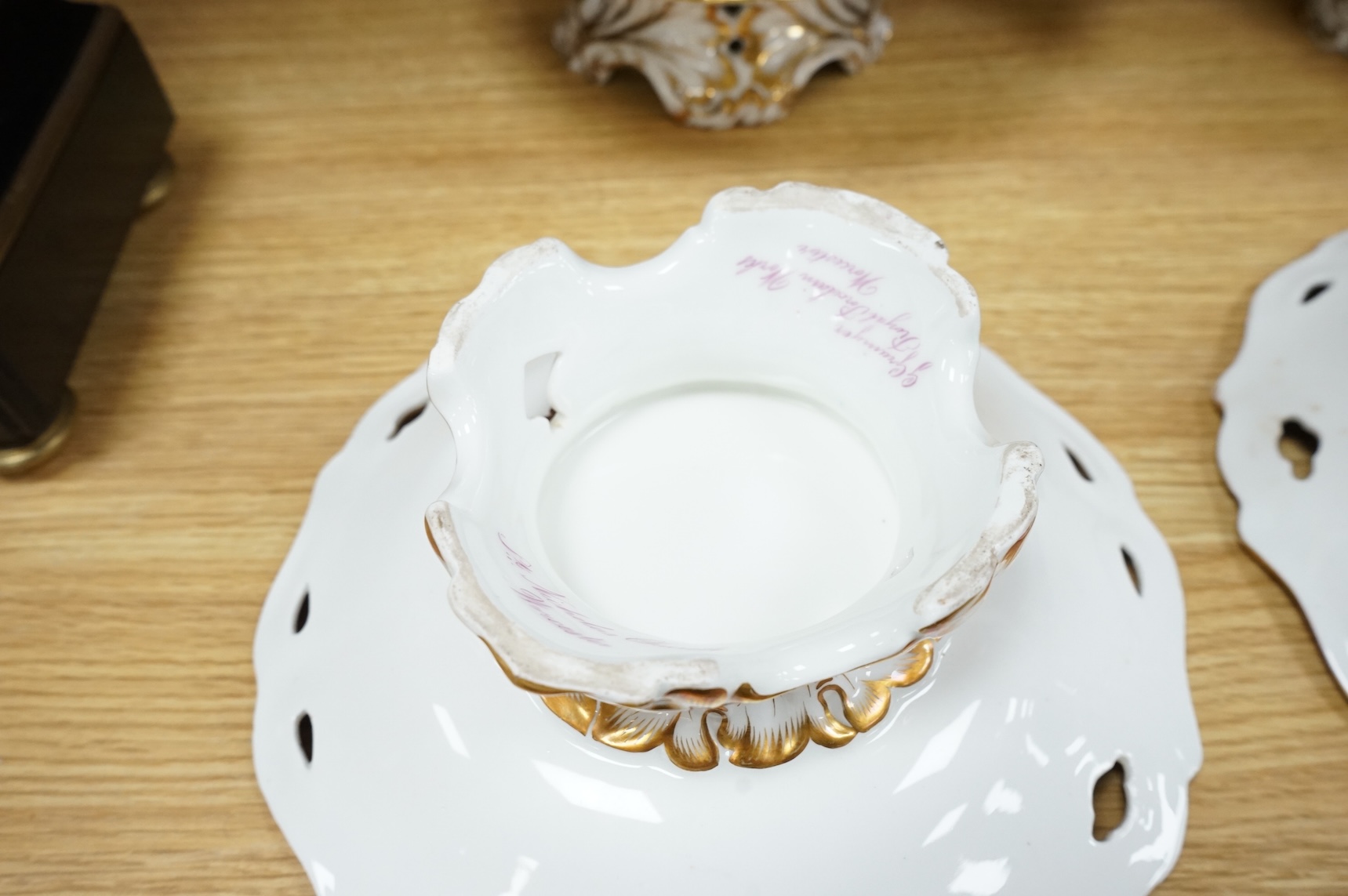 Four G Grainger, Worcester armorial porcelain comports, c.1845, hand painted with named views of Worcester, 24cm in diameter
